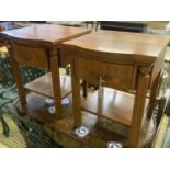 A pair of walnut bowfront two tier bedside tables, width 50cm, depth 50cm, height 61cm