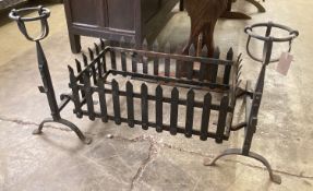 A rectangular wrought iron fire basket, width 114cm, depth 56cm, height 62cm and dogs