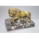 A 19th century bronze of a lion on a marble base, length 19cm