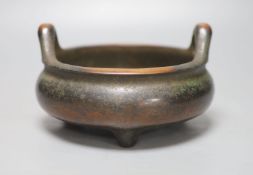 A Chinese bronze tripod censer, diameter 27cm height 10cm