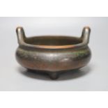 A Chinese bronze tripod censer, diameter 27cm height 10cm