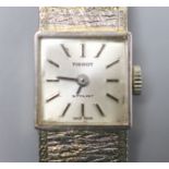 A lady's textured 9ct white gold Tissot manual wind bracelet wrist watch, overall length 17cm, gross