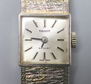 A lady's textured 9ct white gold Tissot manual wind bracelet wrist watch, overall length 17cm, gross