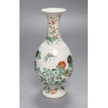 A Chinese famille verte bottle-shaped footed vase, 19th century, decorated with chrysanthemum,