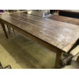 An early 19th century French oak rectangular kitchen table, length 218cm, depth 79cm, height 77cm