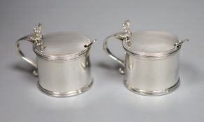 A pair of George V silver drum mustard pots, William Comyns & Sons Ltd, London, 1935, 66mm, 7.5oz,