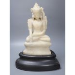 A 19th century Burmese marble crowned Jambhupati Buddha, on stand, overall height 47cm