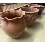 Four circular terracotta garden urns, largest 50cm diameter, 46cm high