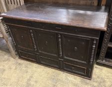 An 18th century panelled oak mule chest, length 117cm, depth 56cm, height 70cm