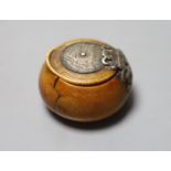 A 17th century French white metal mounted ivory snuff box, with pique work to inner lid, diameter