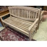 A brand new teak garden bench, length 150cm, depth 62cm, height 92cm