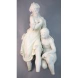 A white marble group of two classical bathers, one partially clad, the other a kneeling nude, height
