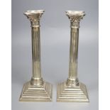 A pair of George VI silver corinthian column candlesticks, RS, London, 1950, height 26.8cm, 19oz.