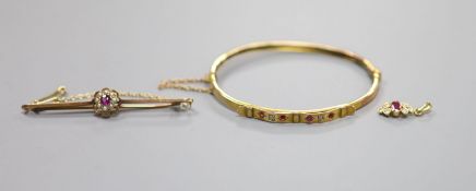 An Edwardian yellow metal, ruby and diamond set hinged bangle(a.f.) gross 5.2 grams, a 9ct, garnet