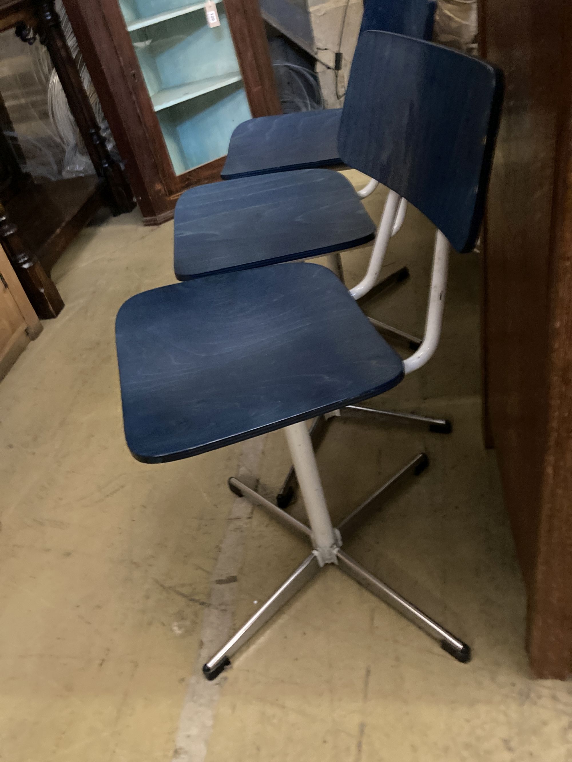 A set of three mid century stained beech and metal childs' swivel chairs - Image 3 of 3