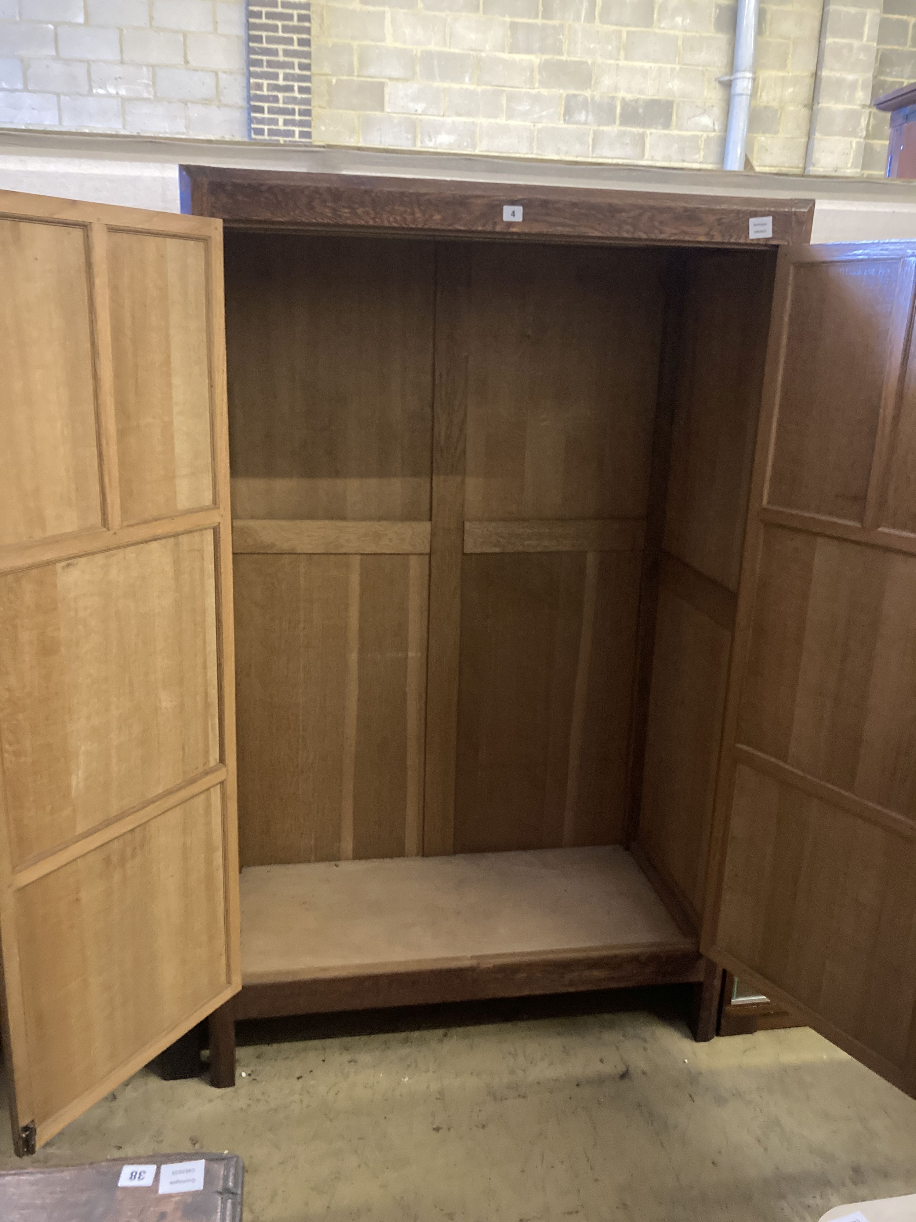 An Arts & Crafts style panelled oak two door wardrobe, width 105cm, depth 55cm, height 168cm - Image 3 of 3