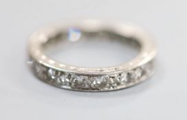 A white metal and diamond set full eternity ring, size K/L, gross 3.5 grams.CONDITION: Two of the