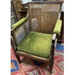 A Regency mahogany bergere armchair, width 67cm, depth 64cm, height 92cm