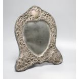 An Edwardian repousse silver mounted shaped easel mirror, Deakin & Francis, Birmingham, 1904,