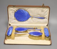 A cased George V silver and blue guilloche enamel six piece dressing set(a.f.) Mappin & Webb,