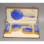 A cased George V silver and blue guilloche enamel six piece dressing set(a.f.) Mappin & Webb,
