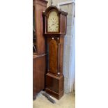 E. Buckwell, Brighton. A late 18th century mahogany eight day longcase clock, with painted arched