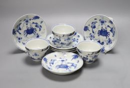 Six Chinese blue and white 'Sea creatures' teabowls and saucers