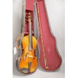 A late 19th century violin and a bow, cased