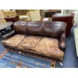 A George Smith Howard style brown leather three seater sofa, length 210cm, depth 106cm, height 84cm