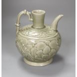 A Chinese carved celadon ewer, 16cm high