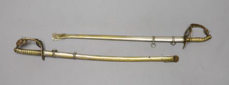 Two early 20th century scale models of late 19th century military swords, longest 24cm