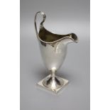 A George III silver helmet cream jug, indistinct maker's mark, London, 1791, 20cm, 5.5oz.