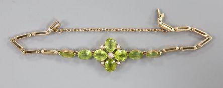 A late Victorian 9ct, peridot and seed pearl cluster set bracelet(adapted), approx. 16.5cm, gross