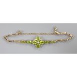 A late Victorian 9ct, peridot and seed pearl cluster set bracelet(adapted), approx. 16.5cm, gross