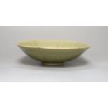 A Chinese carved celadon dish, 18.5cm diameter