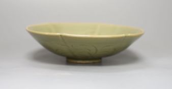 A Chinese carved celadon dish, 18.5cm diameter
