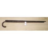 Victorian bamboo measuring stick and an Irish bog oak walking stick, longest 90cm