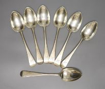 A harlequin set of seven Victorian silver Old English pattern dessert spoons, various dates and