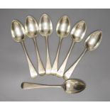 A harlequin set of seven Victorian silver Old English pattern dessert spoons, various dates and