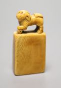 A 17th / 18th century Chinese ivory 'dog' seal, height 7cm