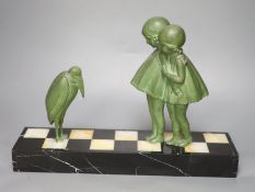 After Dimitre Chiparus (1889-1947), green-patinated spelter figure of two girls fascinated by a