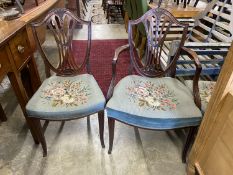 A set of six Hepplewhite style mahogany shield back dining chairs with tapestry drop in seats (two