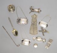 Two white metal novelty pepperettes, three modern silver decanter labels and minor items.