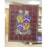 An armorial stained glass panel, in a brass frame, 44.5 x 35cm