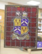 An armorial stained glass panel, in a brass frame, 44.5 x 35cm