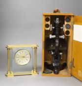 An oak-cased black japanned microscope, case 35cm high, width 16cm, 20cm depth and a brass mantel