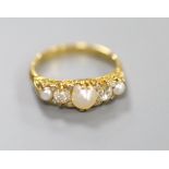 An Edwardian yellow metal, split pearl and diamond set half hoop ring, size N, gross 3.6 grams.