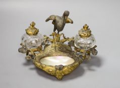 A 19th century French brass gilt metal and mother of pearl 'crane' desk stand, height 13cm