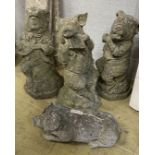Four reconstituted stone garden ornaments, modelled as pigs, largest 60cm high