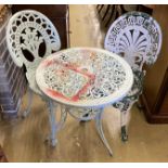 A painted aluminium circular garden table, 60cm diameter and two chairs